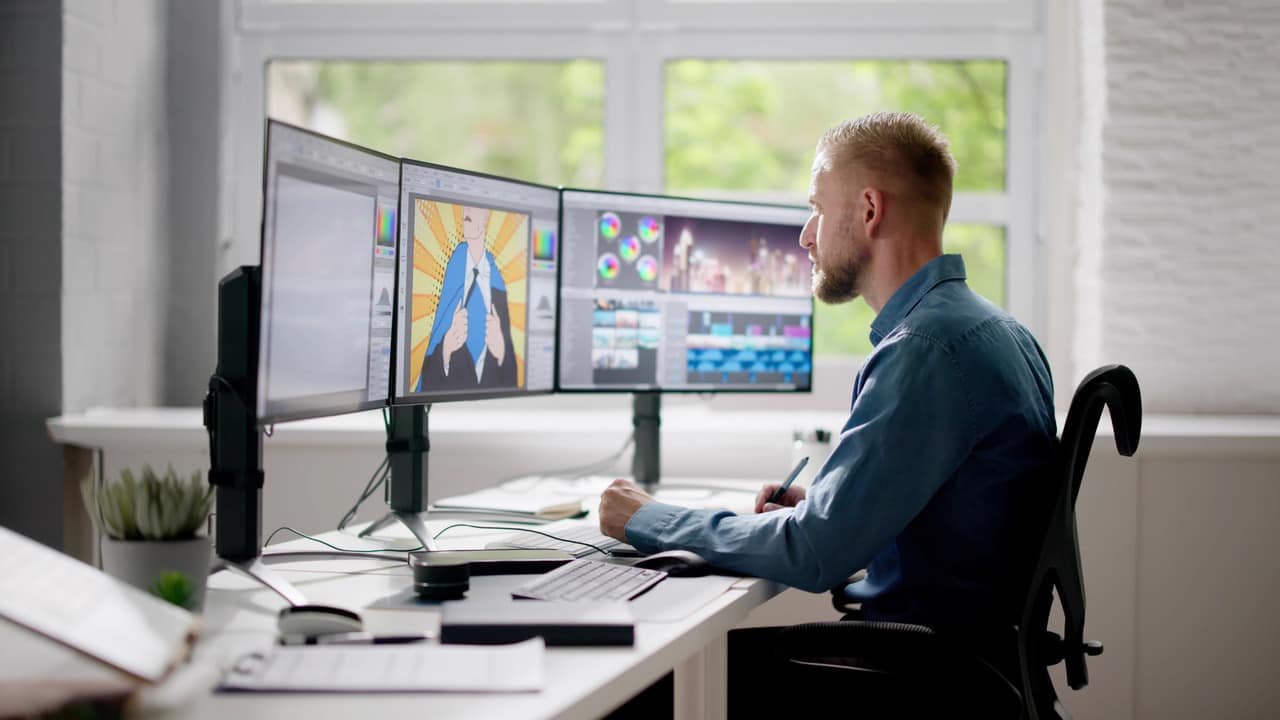 Designer working on graphics and promotional banners