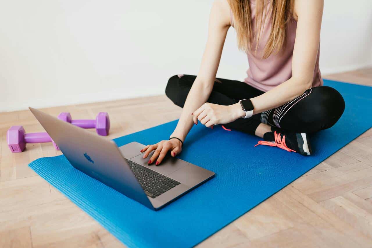 Online yoga teacher running a class
